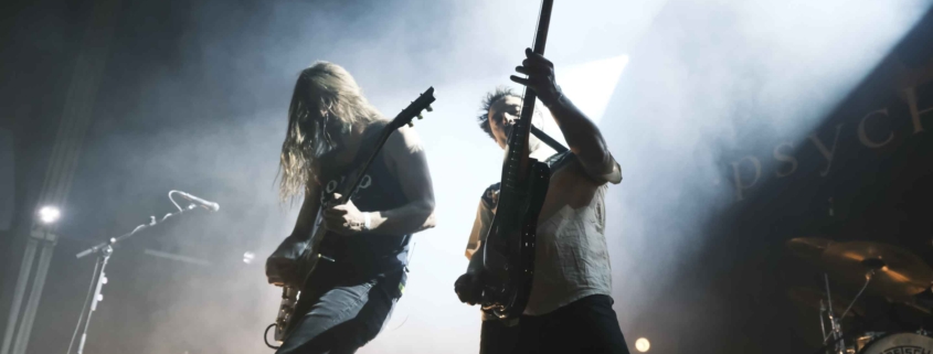 The guitar and bass players of Psychonaut together on stage during a live concert